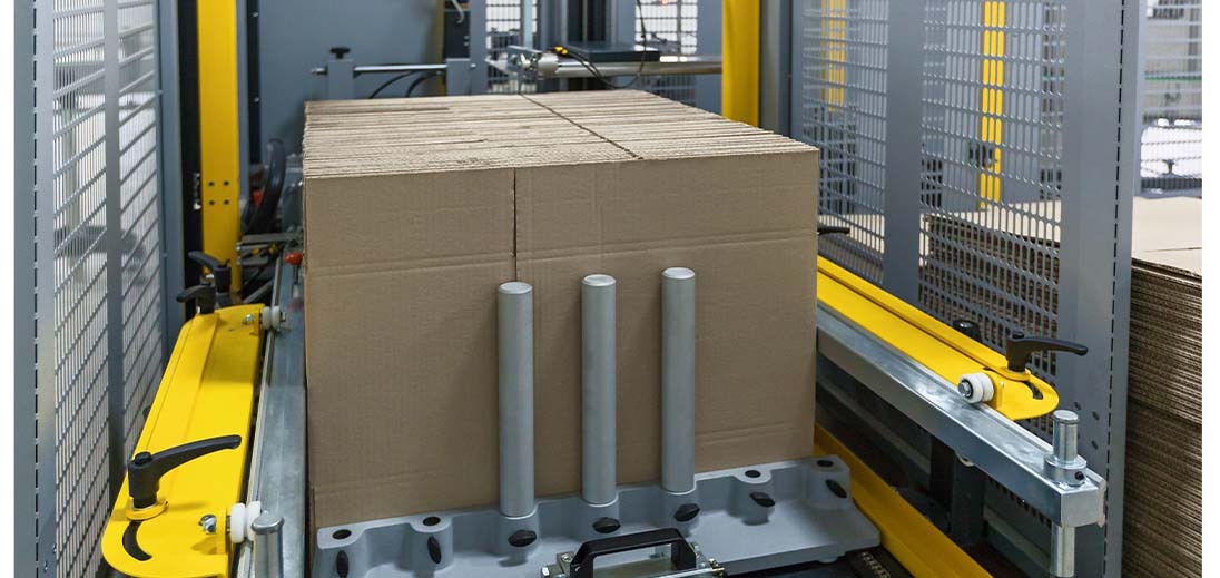  A large package sitting inside an automated package strapping machine
